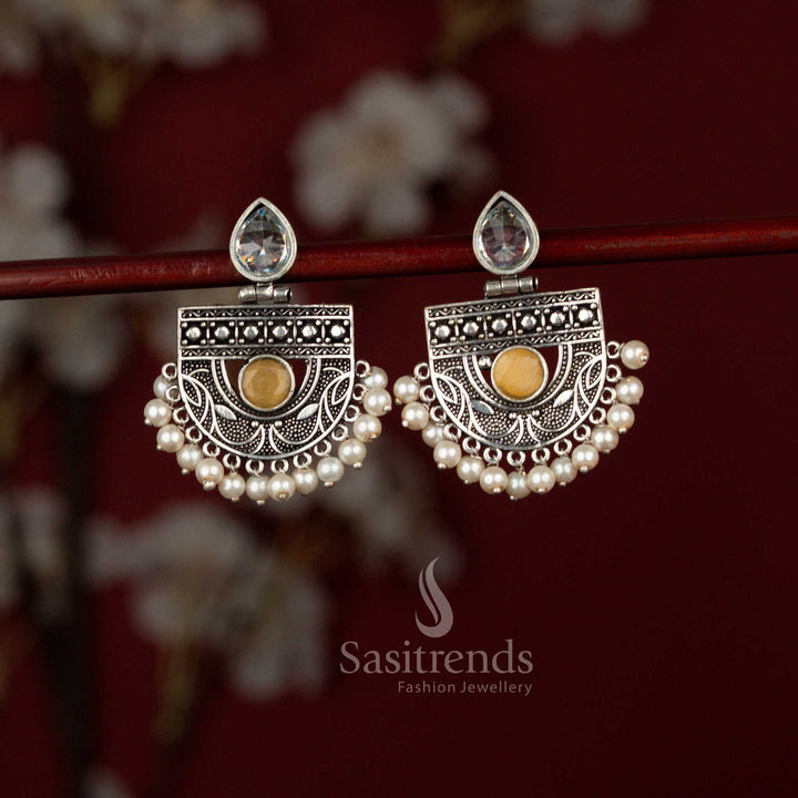 Sasitrends traditional yellow oxidised silver chandbali earrings crafted with a pear-cut stone focal point, detailed metal artistry and soft pearl embellishments that enhance sarees and ethnic outfits.
