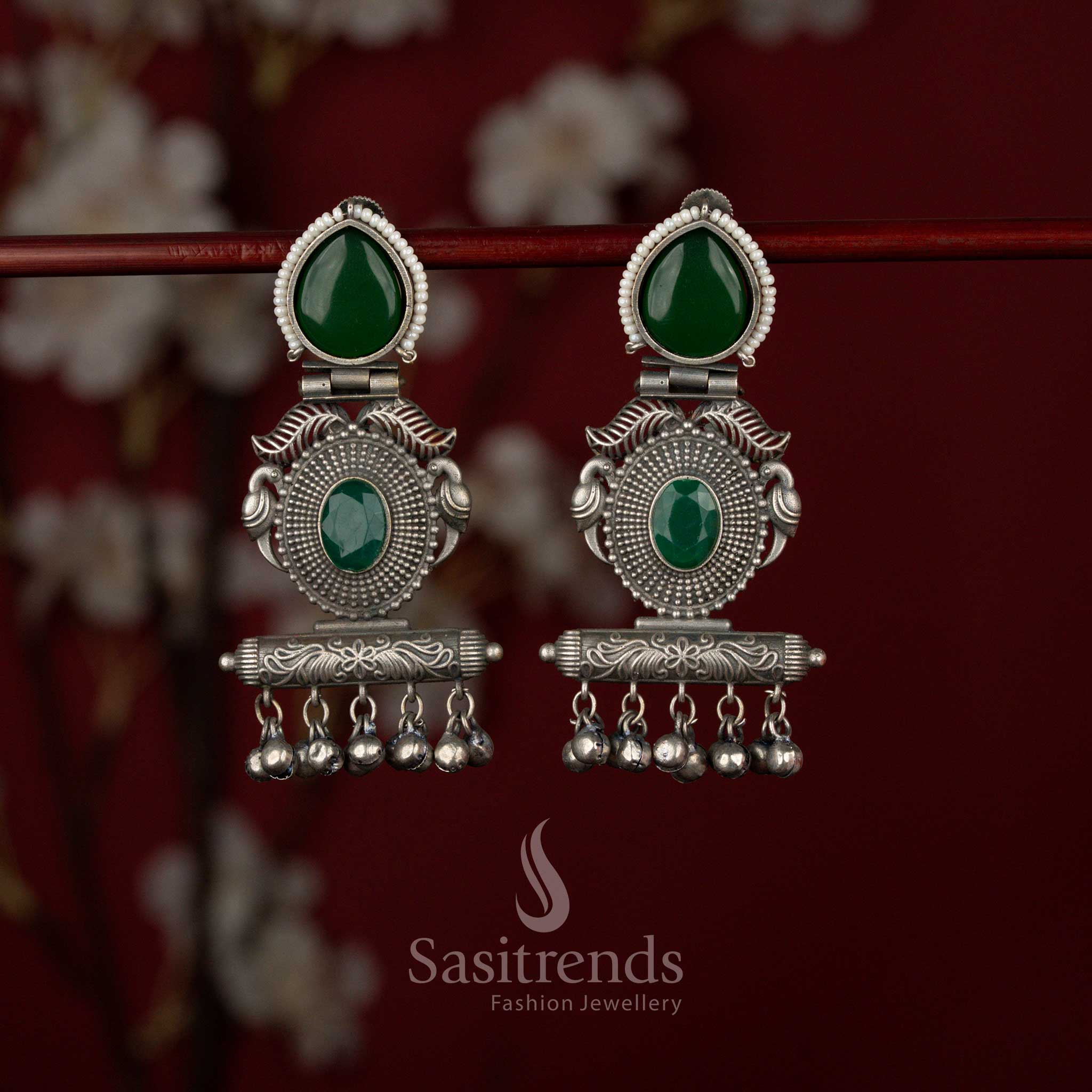 Sasitrends tribal green oxidised German silver earrings designed with a decorative bird motif, structured rectangular architectural base and elegant teardrop stone accents for bold ethnic styling.