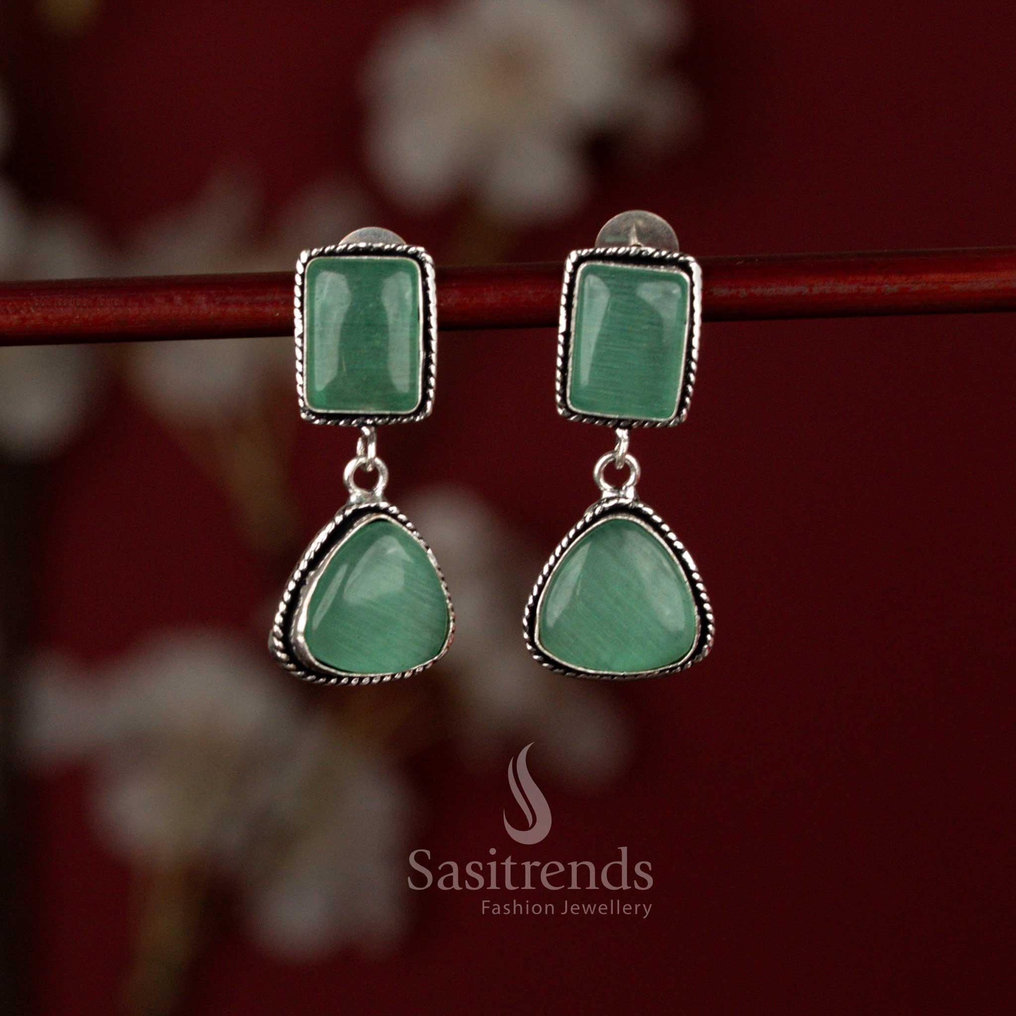 Sasitrends two-tier mint oxidised silver plated earrings featuring a luminous Monalisa stone centerpiece set within square and triangular geometric frames, enhanced with pearl drops for effortless casual styling.