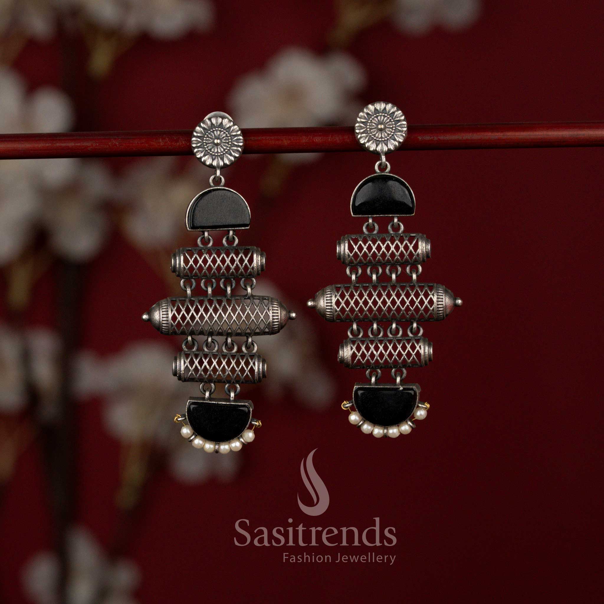 Sasitrends unique antique oxidised silver plated statement earrings designed with a bold barrel cylinder structure, layered textured detailing, decorative black stone panels and a soft pearl drop finish for striking ethnic appeal.