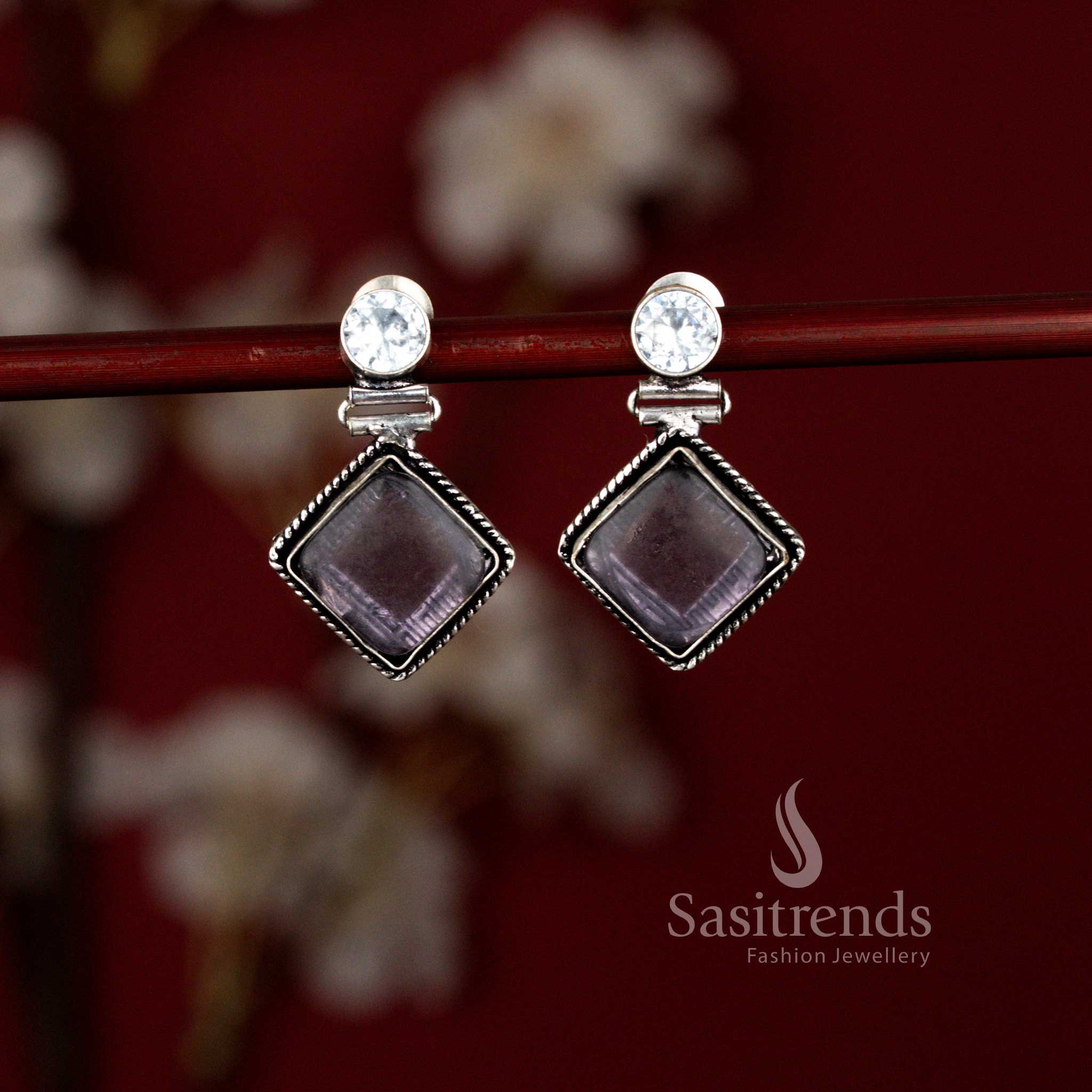 Sasitrends unique oxidised Monalisa purple stone drop earrings crafted in a sleek rhombus shape with an eye-inspired center detail, adding a refined touch to office attire and smart casual outfits.