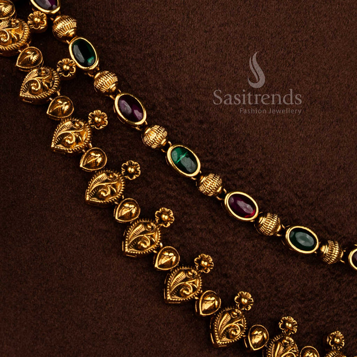 Sasitrends traditional matte gold plated ruby green AD stone bridal double layer necklace set with paisley motifs and bead hangings