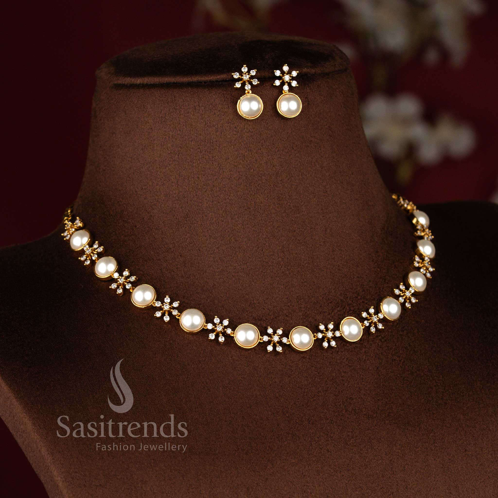 Sasitrends white American Diamond pearl matte gold plated necklace set with floral connectors and circular pearl frames