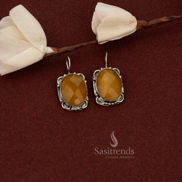 Sasitrends yellow oxidised German silver earrings designed with oval faceted stone and detailed vintage floral frame for casual wear
