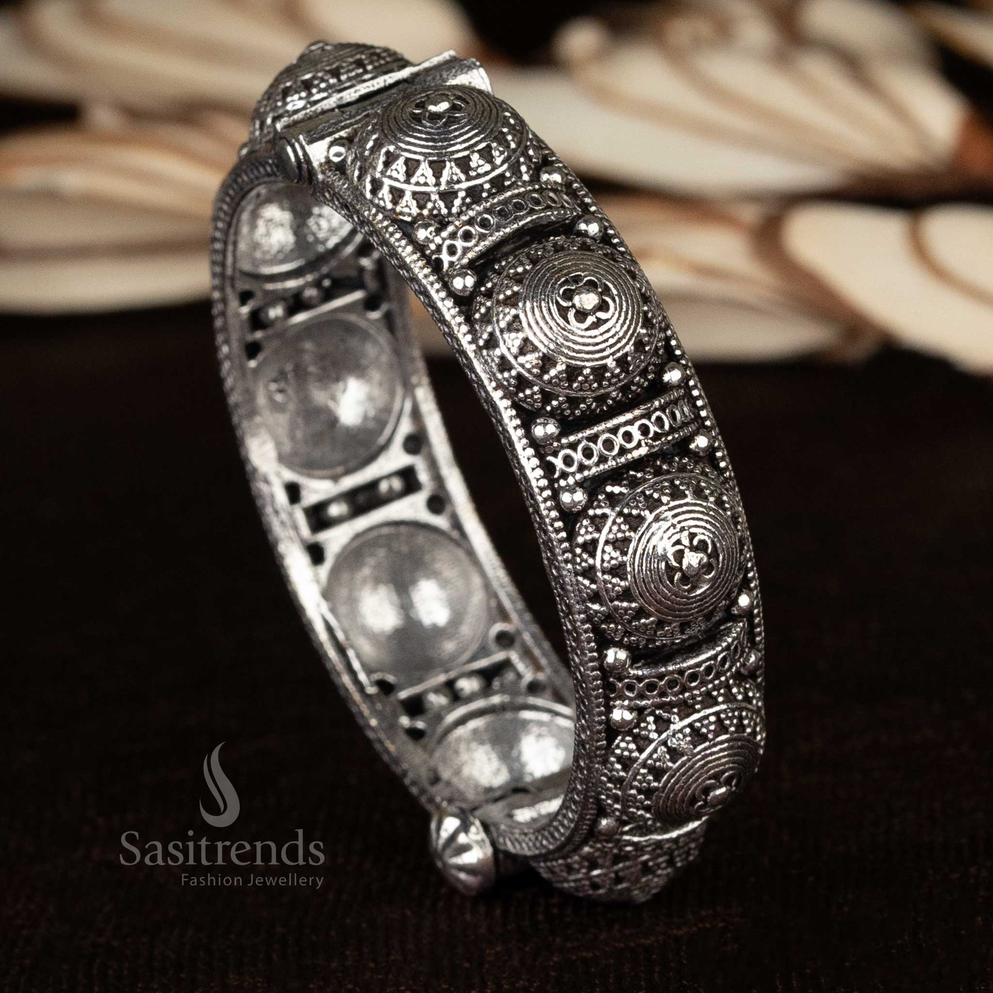 Ethnic oxidized kada bangles showcasing a combination of floral and elephant motifs, handcrafted for women - Sasitrends