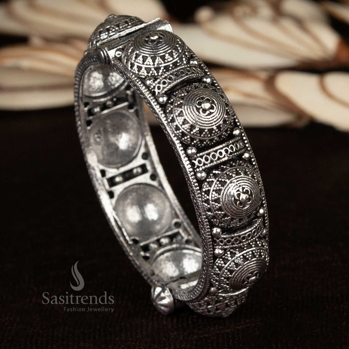 Ethnic oxidized kada bangles showcasing a combination of floral and elephant motifs, handcrafted for women - Sasitrends