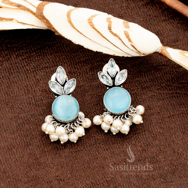 Traditional oxidised German silver earrings featuring sky-blue Monalisa stones, AD accents, and pearl drops—exuding celestial ethnic grace with airy pastel elegance - Sasitrends