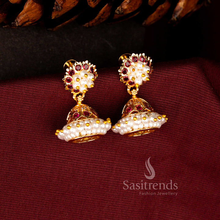 Captivating micro gold plated earrings in white-ruby featuring AD floral artistry with pearl cluster centre and ornate dome drop silhouette – Sasitrends