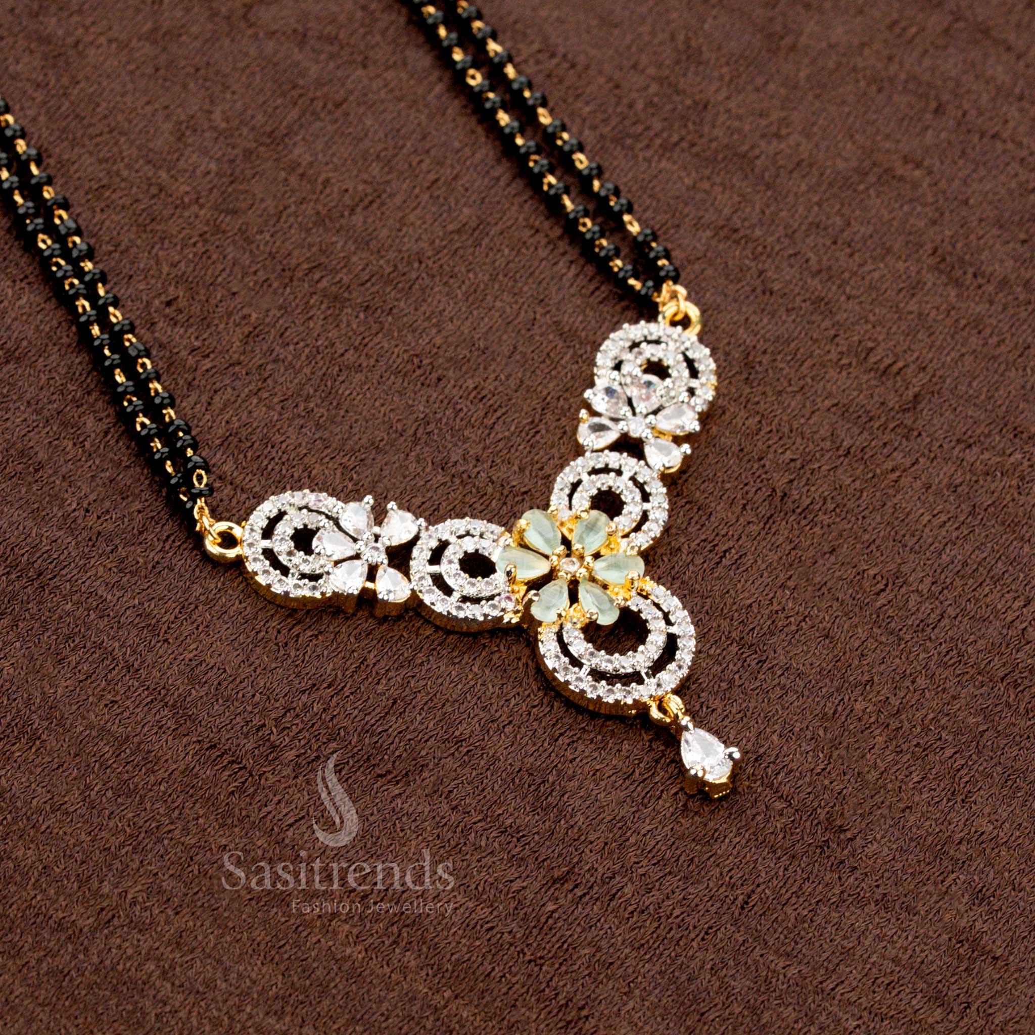 Graceful mint AD pendant set with a circular floral pattern, featuring a Mangalsutra chain and matching earrings, micro gold plated for a classic traditional jewellery look - Sasitrends