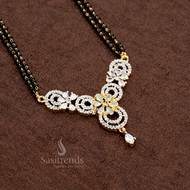 Graceful mint AD pendant set with a circular floral pattern, featuring a Mangalsutra chain and matching earrings, micro gold plated for a classic traditional jewellery look - Sasitrends