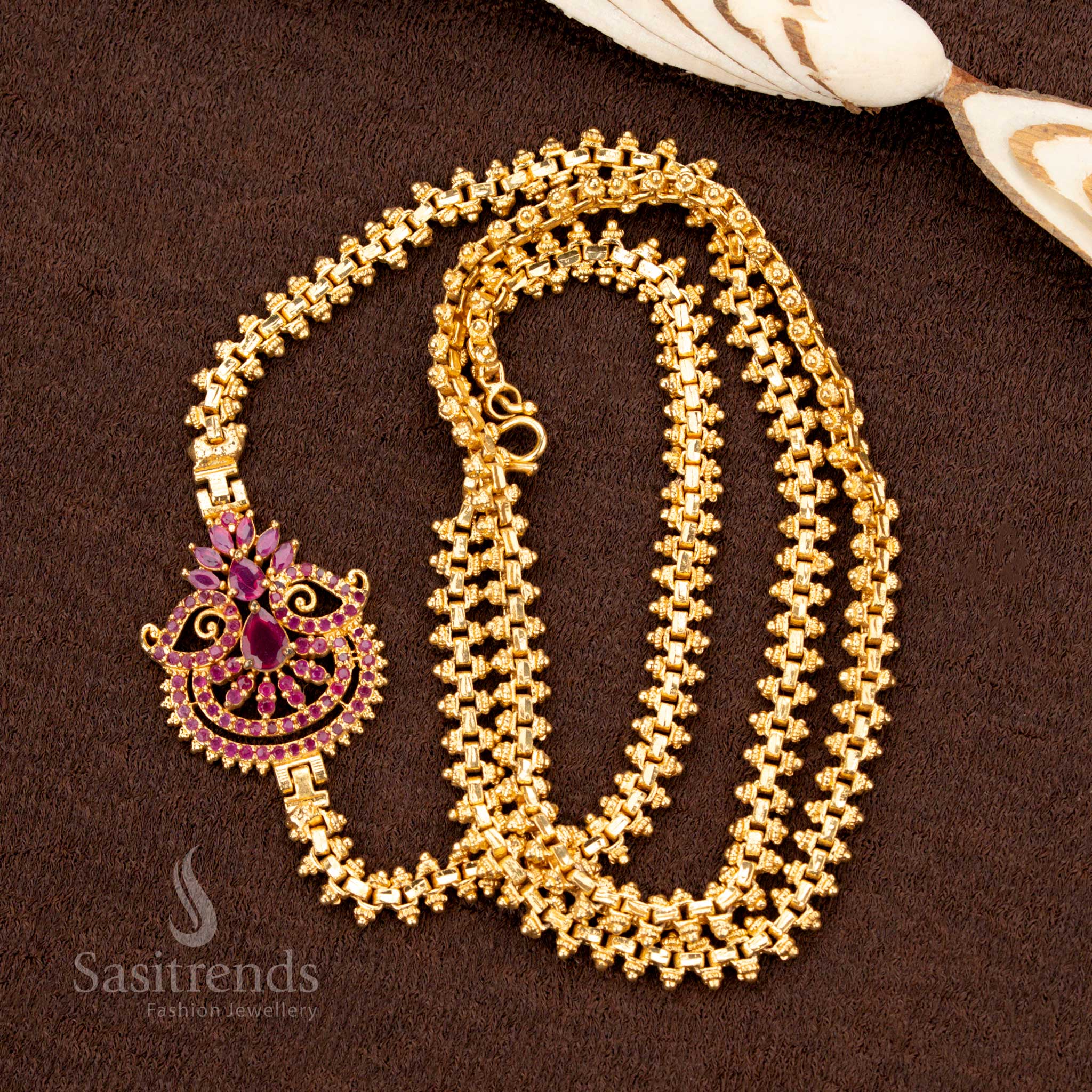 Exquisite ruby AD stone Mugappu chain with floral fan detailing, micro gold plated with a one-gram finish for an opulent saree jewellery masterpiece - Sasitrends