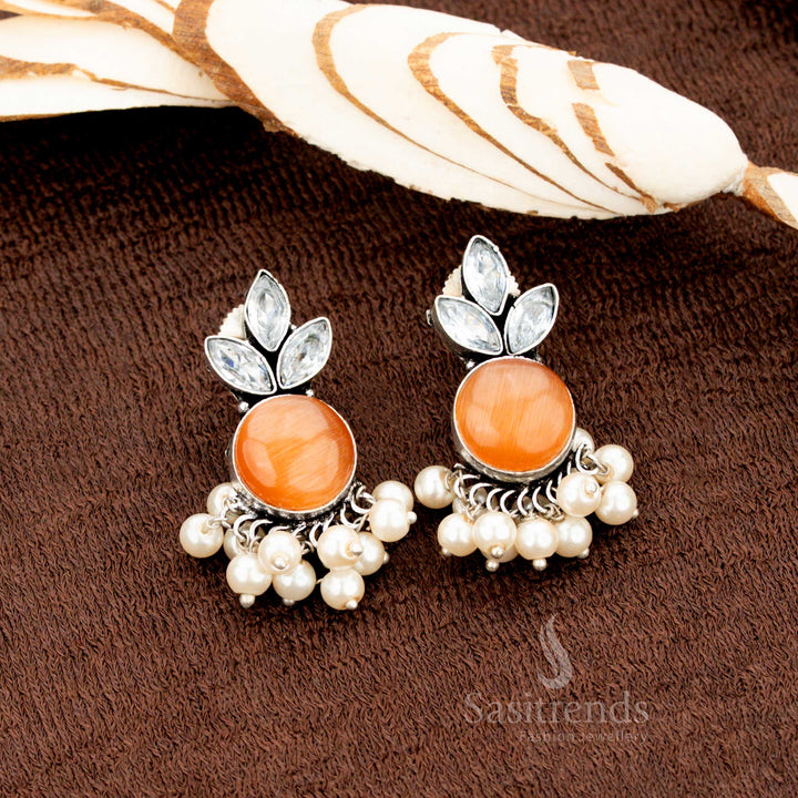 Oxidised German silver earrings with orange Monalisa and AD stones, finished with pearl drops—a harvest-inspired jewellery set ideal for Navratri, Diwali, and traditional Indian festivals - Sasitrends