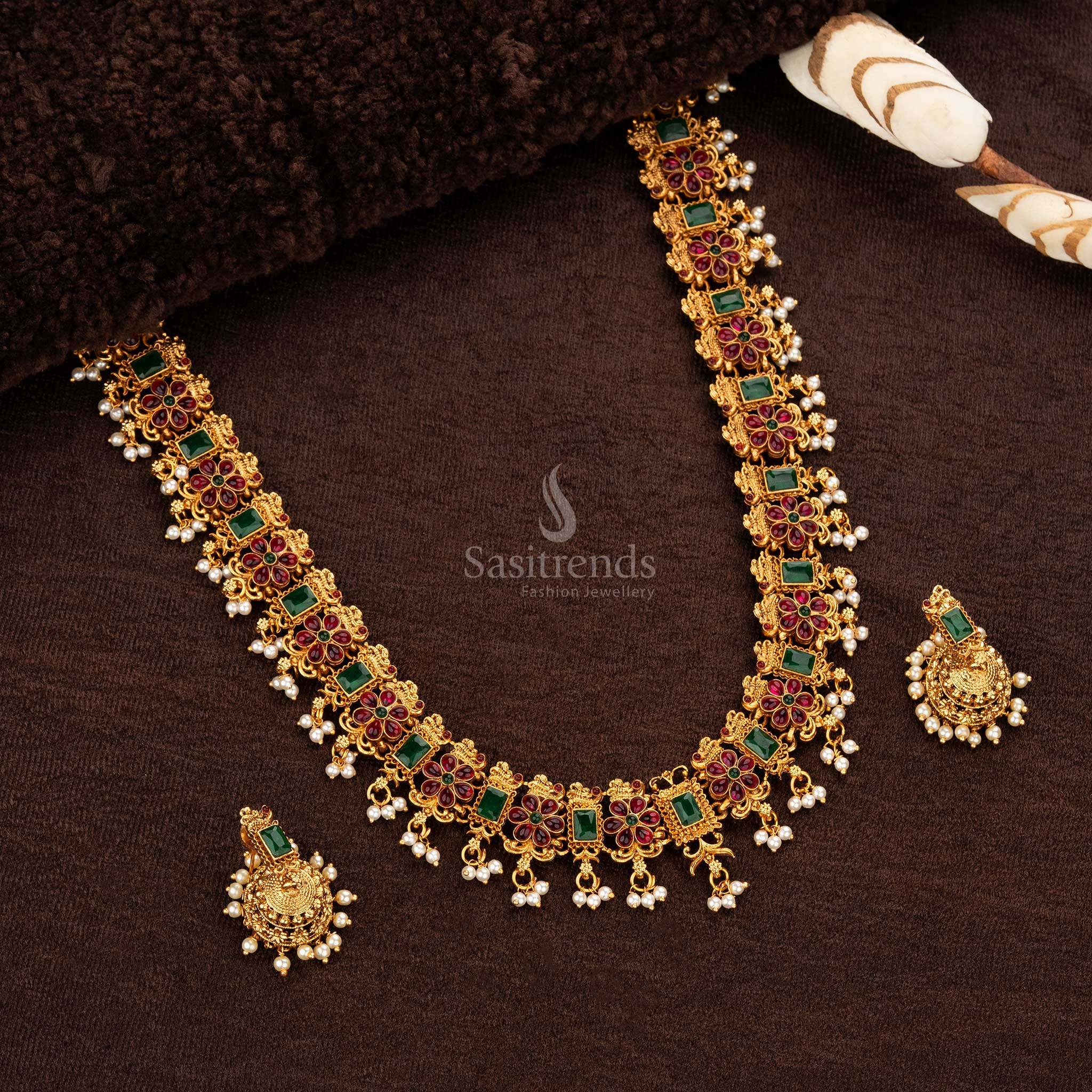 Wedding haram set with intricate patterns and pearl drops – Ruby-Green combination - Sasitrends