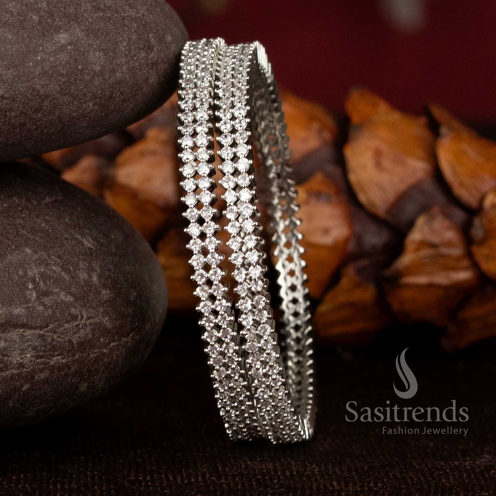 Traditional double-line white silver American diamond bangles in micro gold plating with a glowing finish and 1-year guarantee, perfect for festive and temple looks by Sasitrends