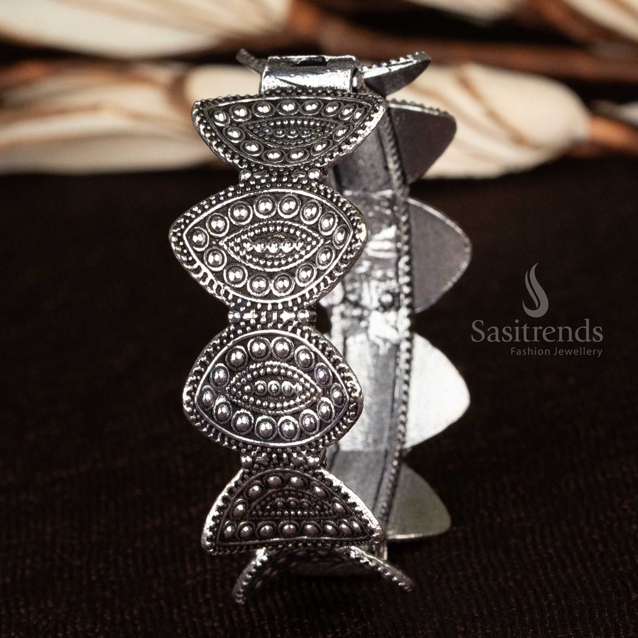 Silver oxidized openable kada bangle engraved with floral patterns, embodying timeless elegance - Sasitrends