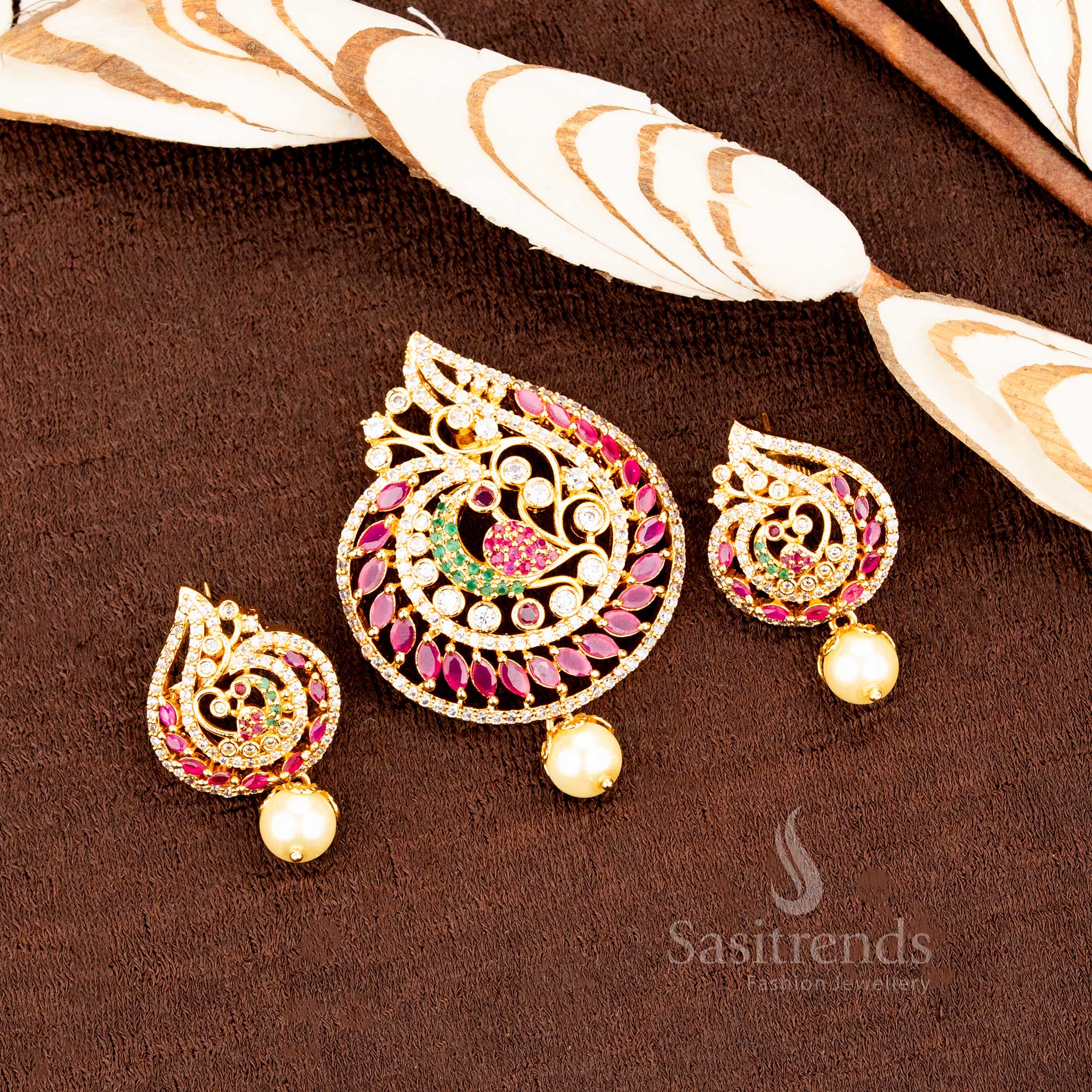 Regal peacock design micro gold plated pendant with multicolour AD stones and matching earrings, crafted for grand traditional looks and festive jewellery brilliance by Sasitrends
