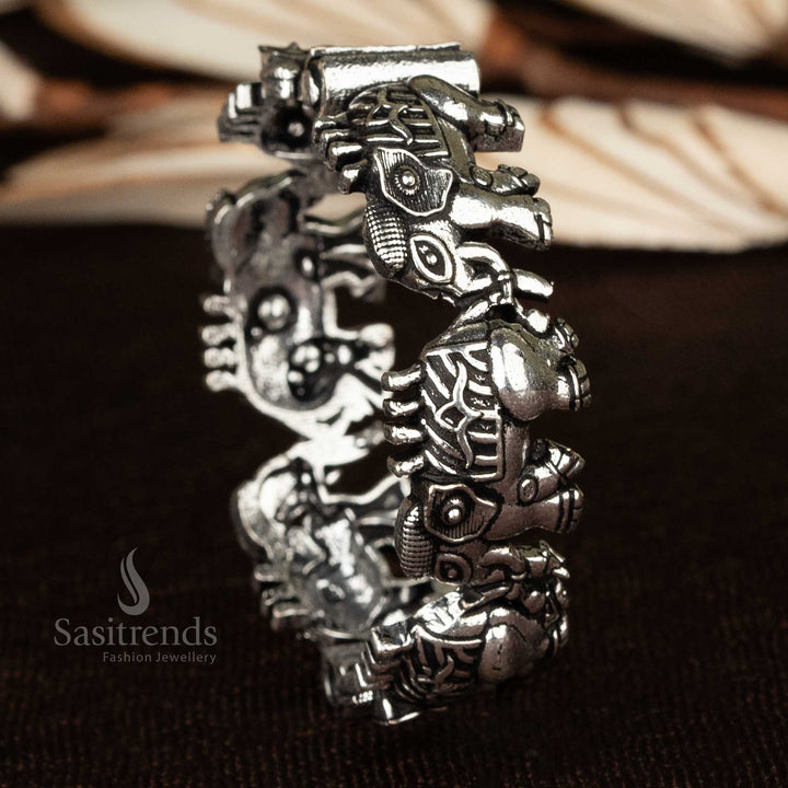 A unique oxidized openable kada bangle with ethnic floral and elephant designs for traditional styling - Sasitrends