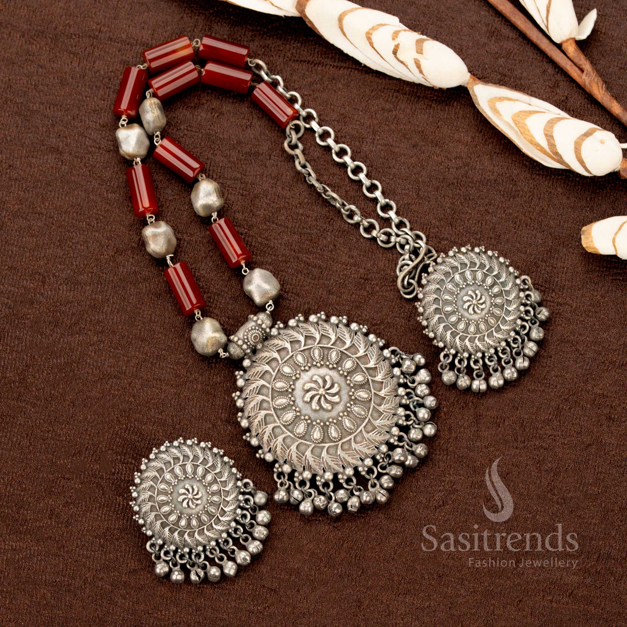 Oxidised traditional floral statement necklace with a bold round maroon stone pendant and matching earrings—an iconic festive heritage jewellery set, ideal for Navaratri styling with silk or cotton sarees - Sasitrends
