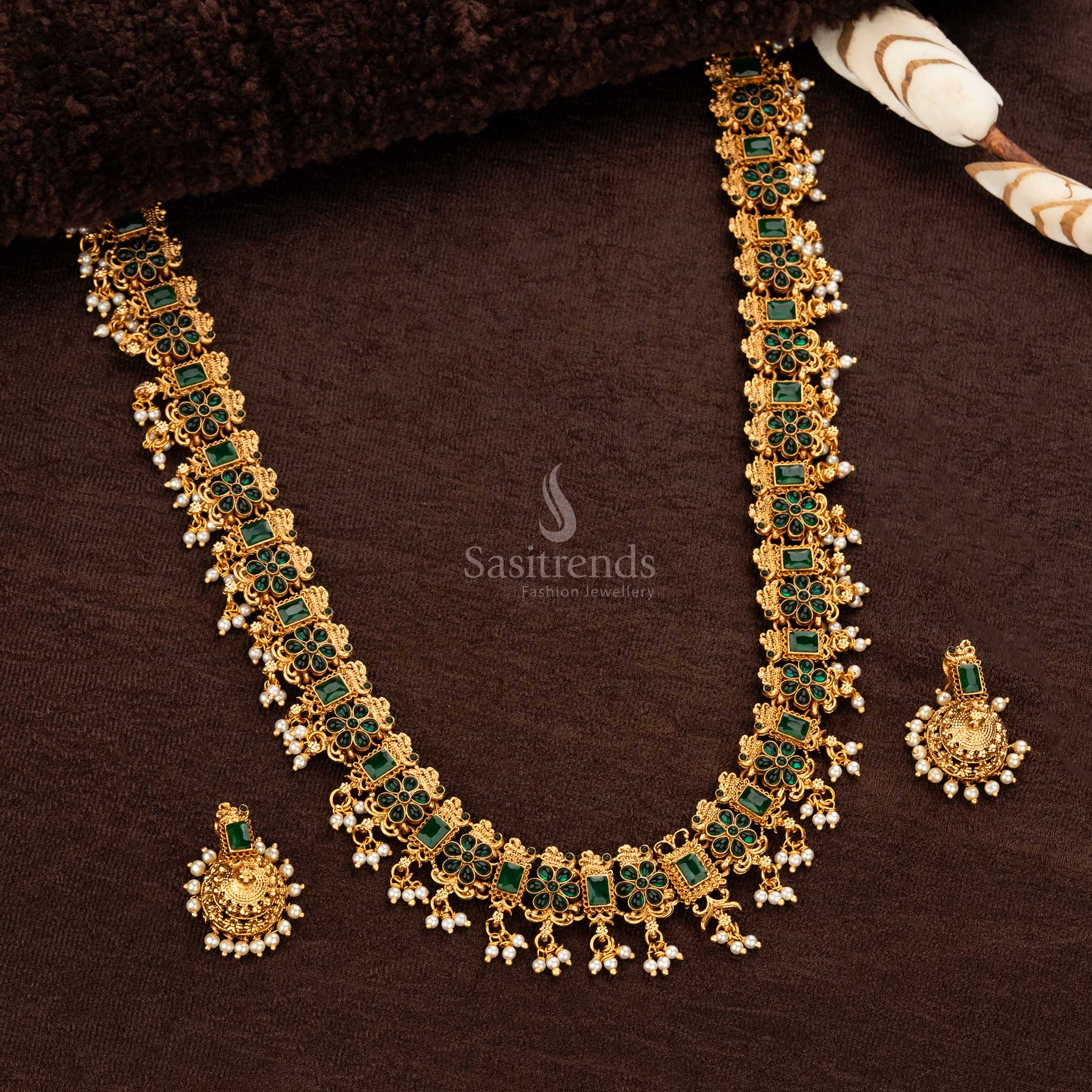 Elegant temple jewellery set featuring Green vibrant gemstones and matching jhumka earrings - Sasitrends