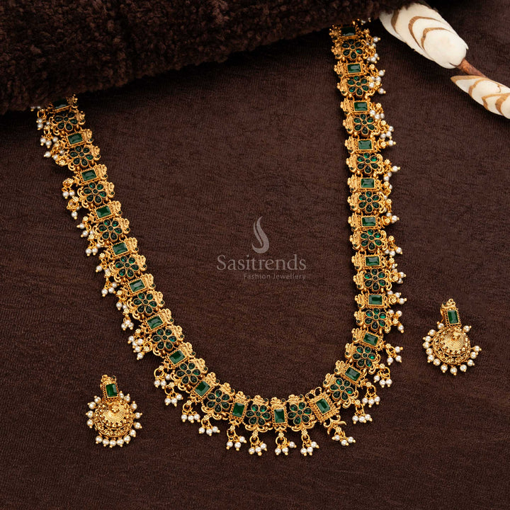 Elegant temple jewellery set featuring Green vibrant gemstones and matching jhumka earrings - Sasitrends