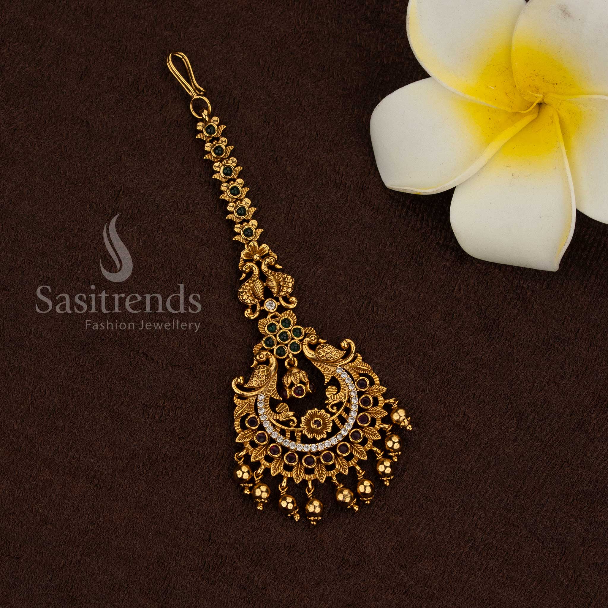 Temple matte gold plated peacock motif maang tikka with multi kemp AD stone detailing and hanging bead drops, rich premium look ideal for bridal, wedding, and temple wear - Sasitrends
