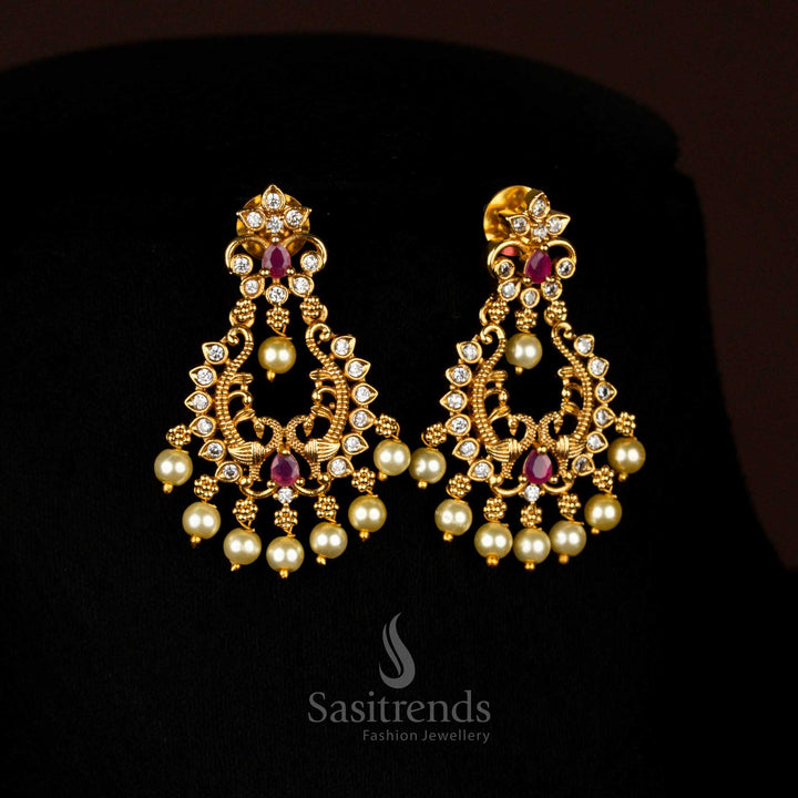 Opulent white-Ruby Matte Gold Plated Temple Drop Earrings with Artistic Filigree Design and Brilliant AD Stones, Ideal for Festive Celebrations – Sasitrends