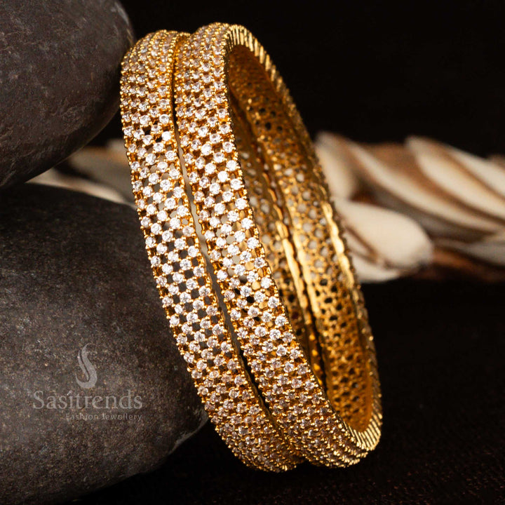 Micro gold plated traditional bangles adorned with sparkling white American diamond stones – a radiant ethnic jewellery piece perfect for bridal wear and classic styling by Sasitrends