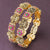 Elegant Bridal Accessory: Lakshmi bangle, lotus, floral pattern, American diamond studded, brass material, black matte gold plating