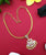 Impon Pendant Chain Necklace with Peacock Motifs and White-Ruby Stones