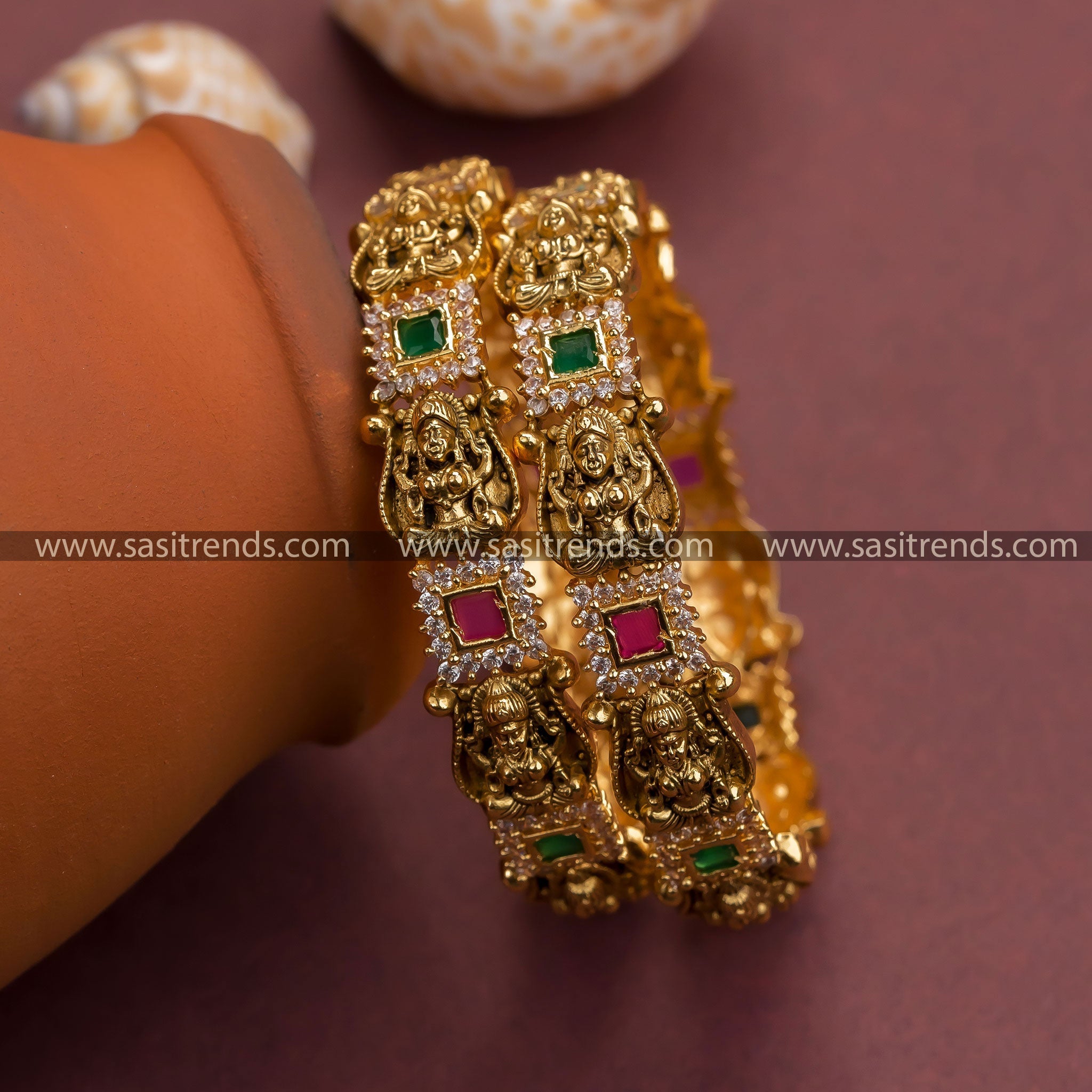 Matte gold plated Lakshmi bangles with multi-color stones - Traditional elegance