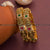Matte gold plated Lakshmi bangles with multi-color stones - Traditional elegance